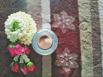 High angle view of pink flower on table