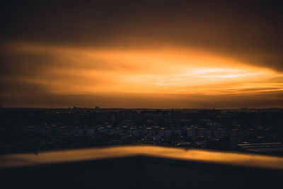 Silhouette buildings against sky during sunset