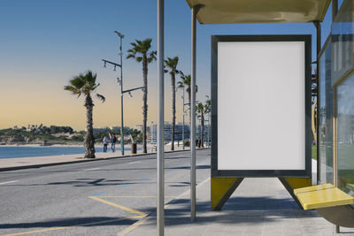 Blank advertisement in a bus stop, next to the sea