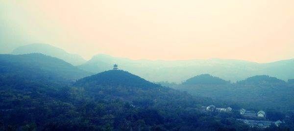 Scenic view of mountains in foggy weather