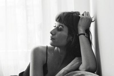 Young woman sitting at home