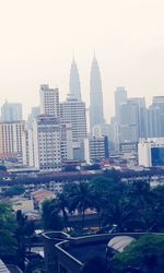 Skyscrapers in city against clear sky