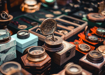 High angle view of antique navigational compass on table