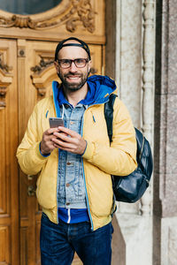 Portrait of a man with mobile phone