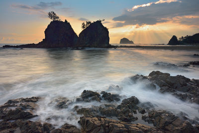 Scenic view of sea against cloudy sky