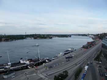 High angle view of city by road against sky