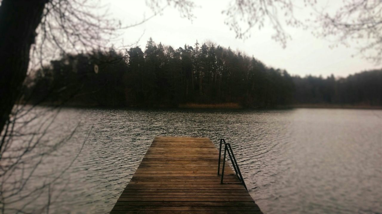 water, lake, tranquility, tranquil scene, tree, wood - material, pier, sky, nature, scenics, beauty in nature, reflection, wood, river, jetty, rippled, wooden, outdoors, non-urban scene, idyllic