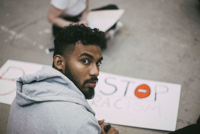 Portrait of male activist making signboard