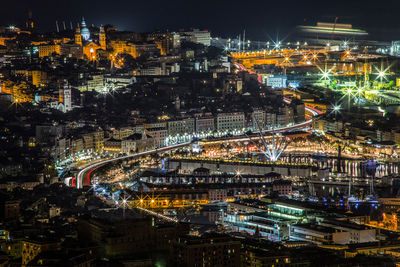 High angle view of illuminated buildings in city at night