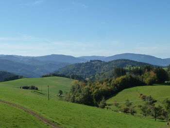 Scenic view of landscape and mountains against sky