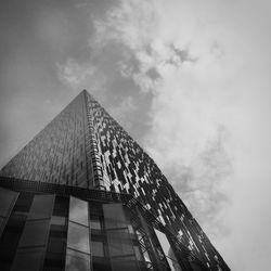 Low angle view of building against cloudy sky