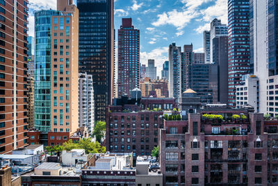 Modern buildings in city against sky