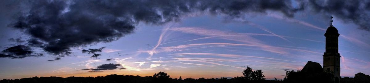 Low angle view of silhouette trees against sky at sunset