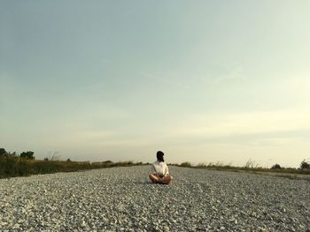 Woman sitting on the ground