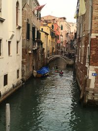 Canal amidst buildings in city