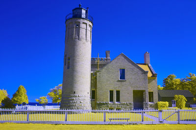 Low angle view of building against clear blue sky