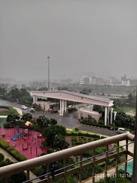 High angle view of buildings and trees against sky