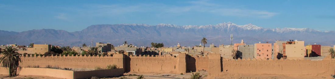 Panoramic view of castle on mountain against sky