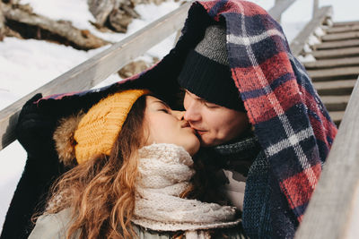 Close-up of kissing during winter