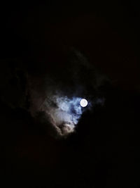 Low angle view of moon in sky at night