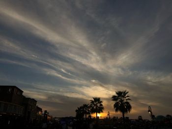 Low angle view of silhouette buildings against sky during sunset