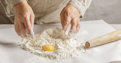 Midsection of chef preparing food