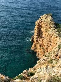 High angle view of rock formation in sea