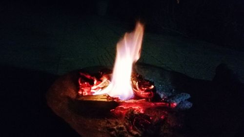 Close-up of fire burning at night