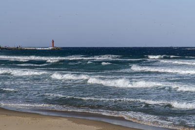 Scenic view of sea against clear sky