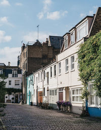 Street amidst buildings against sky