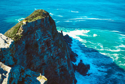 High angle view of rock formation in sea