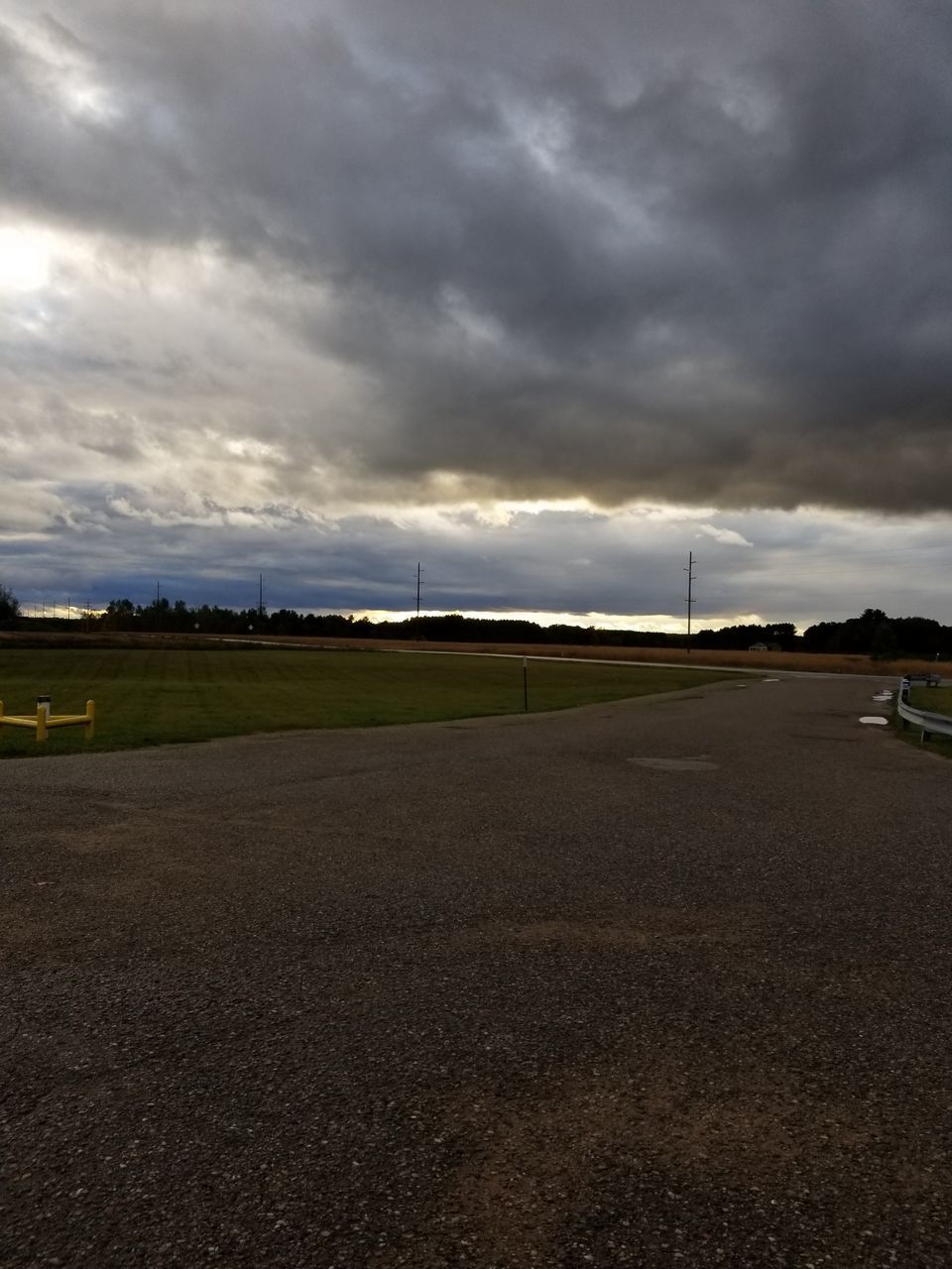 VIEW OF LANDSCAPE AGAINST STORM CLOUDS