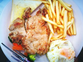 Close-up of meat with vegetables on plate