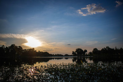 Scenic view of lake against sky during sunset