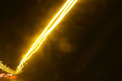 Low angle view of trees against sky at night