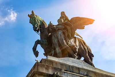 Low angle view of statue against sky