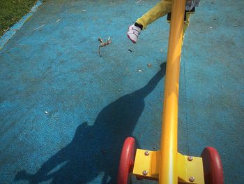 Low section of child playing in playground