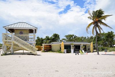 Built structure on beach against sky