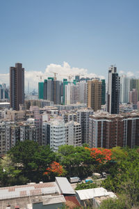 Buildings in city against sky