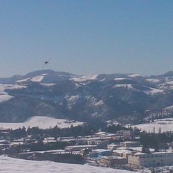 Scenic view of mountains against blue sky