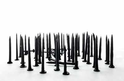 Close-up of metallic objects against white background