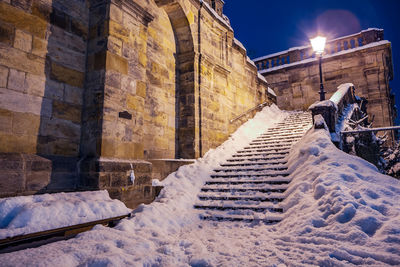 Low angle view of building covered with snow