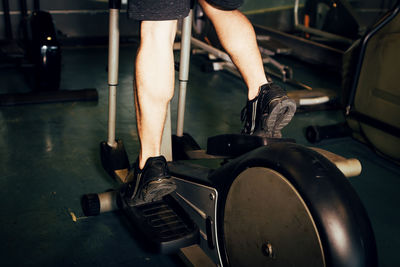 Low section of man exercising in gym