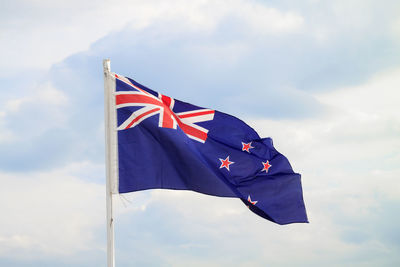 Low angle view of flag against sky