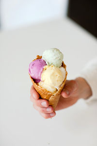 Cropped image of hand holding ice cream