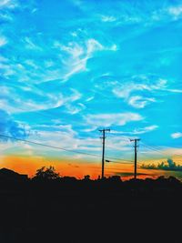 Silhouette landscape against sky during sunset