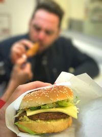 Close-up of man eating food