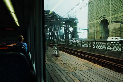 Rear view of man on railroad station platform