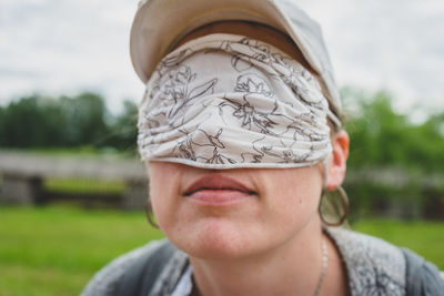 A girl with a hygienic anti-covid mask on her eyes