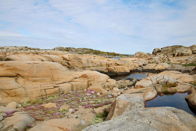 Scenic view of rock formations against sky